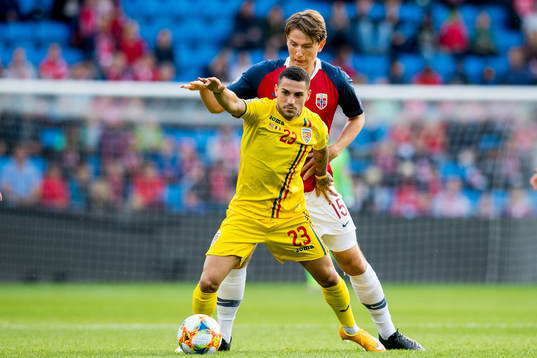Nicolae Stanciu of Romania and Sander Berge of Norway