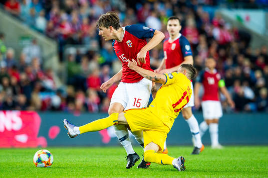 Sander Berge of Norway and Ciprian Deac of Romania