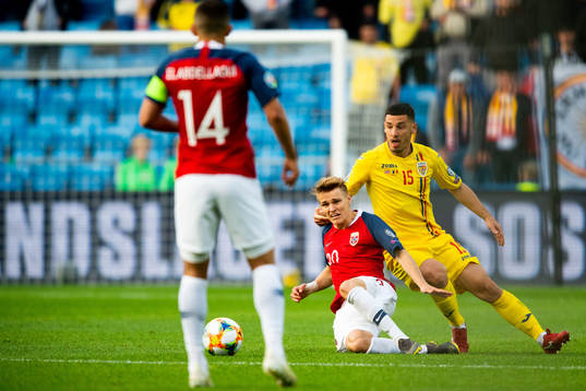 Martin Ødegaard of Norway and Paul Anton of Romania
