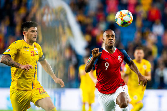 Cristian Sapunaru of Romania and Ola Kamara of Norway