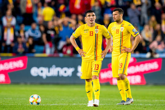 Claudiu Keseru and George Tucudean of Romania look dejected