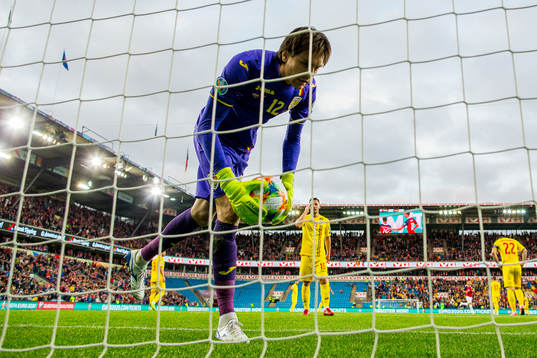 Goalkeeper Ciprian Tatarusanu of Romania looks dejected