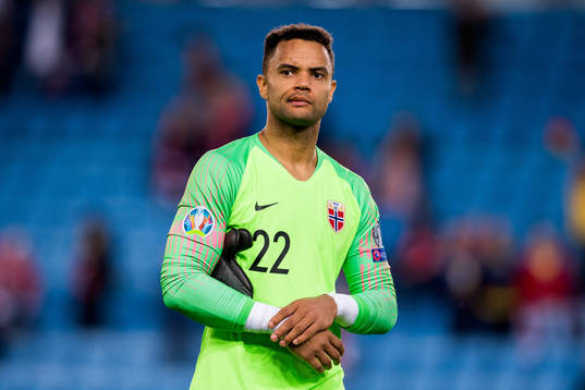 Goalkeeper Sten Grytebust of Norway looks dejected