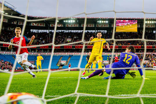 Martin Ødegaard of Norway scores 2-0 behind Cristian