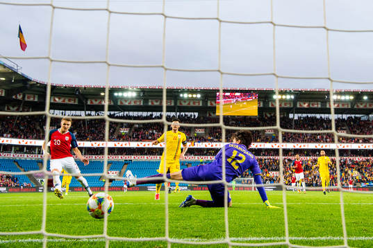 Martin Ødegaard of Norway scores the 2-0 goal behind