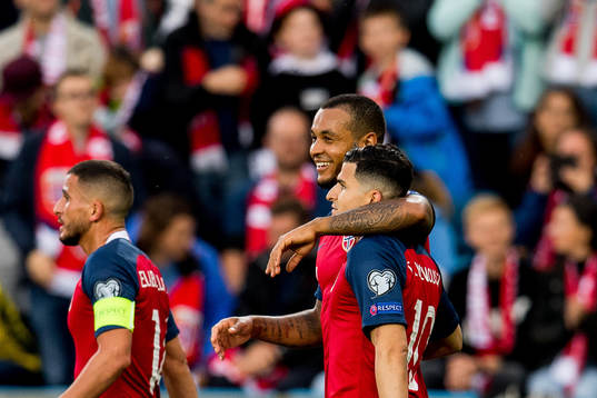 Tarik Elyounoussi of Norway celebrates with teammate Joshua