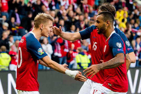 Martin Ødegaard of Norway celebrates with teammate Joshua