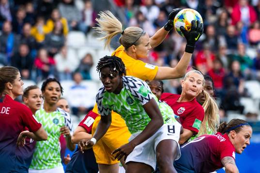 Asisat Oshoala of Nigeria and goalkeeper Ingrid Hjelmseth