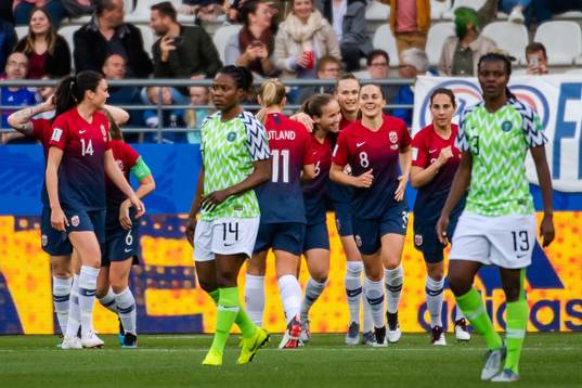 Guro Reiten of Norway celebrate with teammates