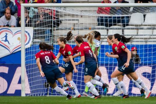 Guro Reiten of Norway celebrate with teammates