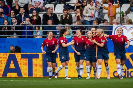 Guro Reiten of Norway celebrate with teammates