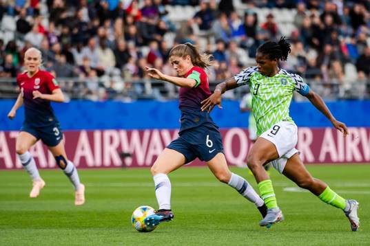 Maren Nævdal Mjelde of Norway and Desire Oparanozie of