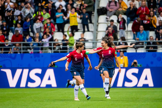 Maren Nævdal Mjelde and Vilde Bøe Risa of Norway celebrate