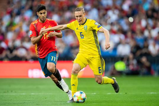 Marco Asensio of Spain and Ludwig Augustinsson of Sweden