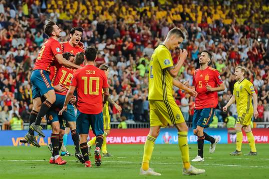 Mikel Oyarzabal of Spain celebrate with teammates