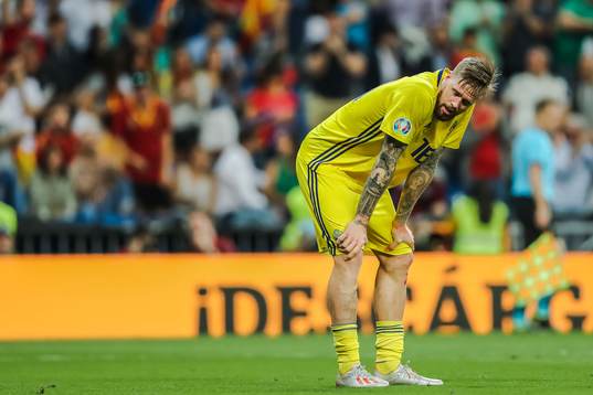 Pontus Jansson of Sweden looks dejected