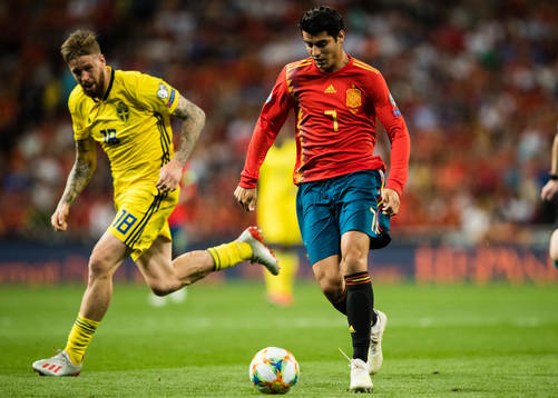 Pontus Jansson of Sweden and Alvaro Morata of Spain