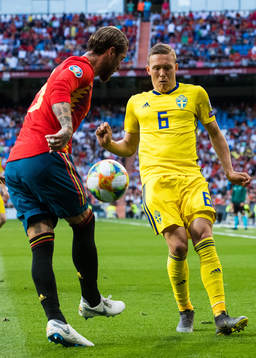 Sergio Ramos of Spain and Ludwig Augustinsson of Sweden