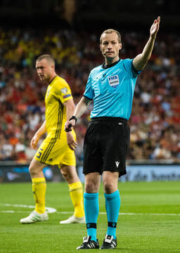 Jacob Johansson of Sweden and referee William Collum