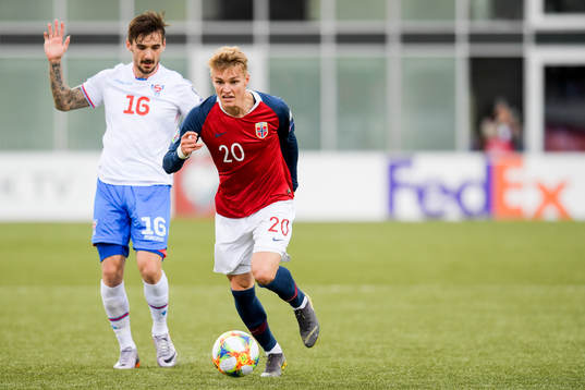 Rene Joensen of Faroe Islands and Martin Ødegaard of Norway