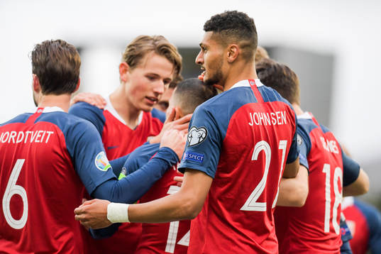 Bjørn Maars Johnsen of Norway celebrates with teammates