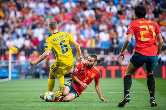 Ludwig Augustinsson of Sweden and Dani Carvajal of Spain