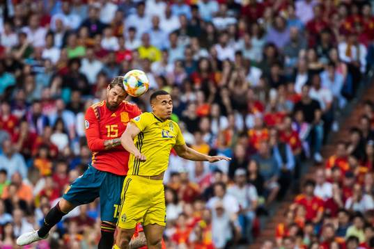 Sergio Ramos of Spain and Robin Quaison of Sweden