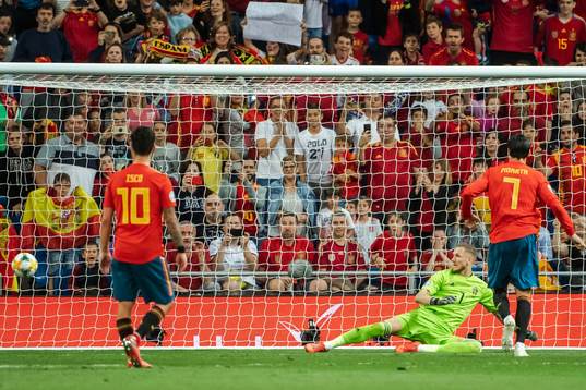 Alvaro Morata of Spain scores 2-0 behind goalkeeper Robin