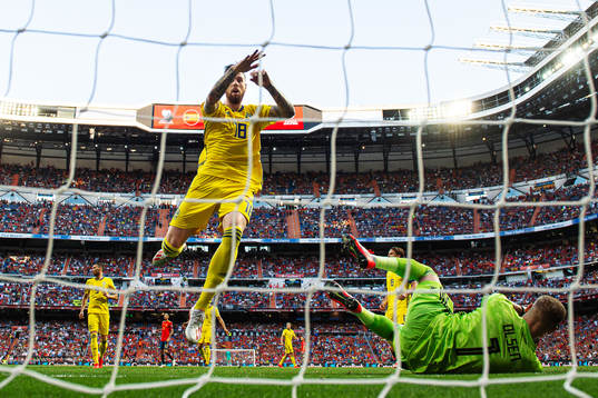 Pontus Jansson ans goalkeeper Robin Olsen of Sweden