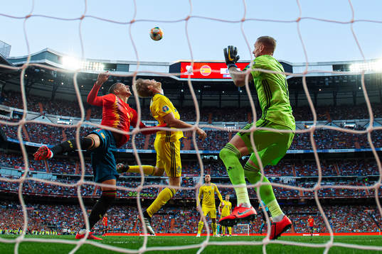 Rodrigo of Spain in action against Filip Helander and