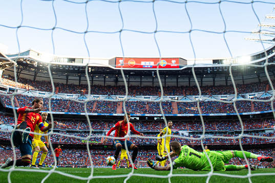 Sergio Ramos and Rodrigo of Spain in action against
