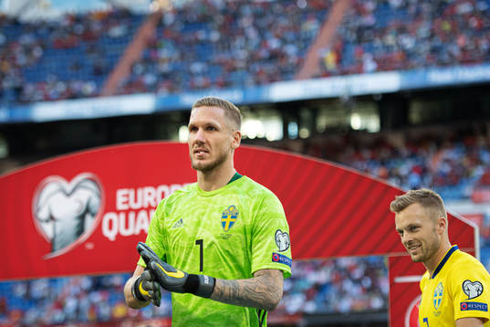 Goalkeeper Robin Olsen and Sebastian Larsson of Sweden