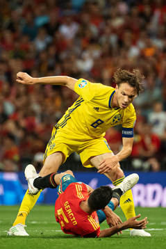 Albin Ekdal of Sweden above Sergio Busquets of Spain