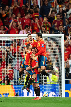 Mikel Oyarzabal of Spain celebrates with teammates