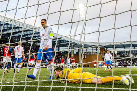 Atli Gregersen and goalkeeper Teitur Gestsson of Faroe