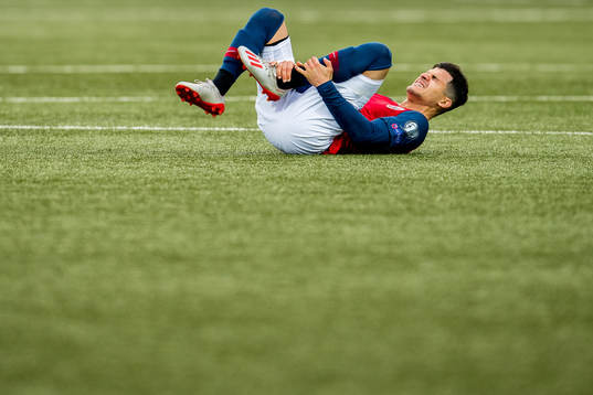 Tarik Elyounoussi of Norway lies down