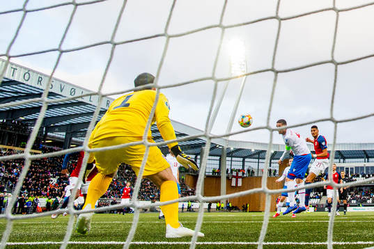Bjørn Maars Johnsen of Norway scores 0-2 behind goalkeeper