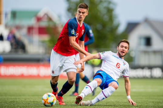 Markus Henriksen of Norway and Hallur Hansson of Faroe