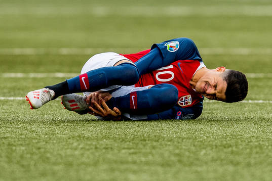 Tarik Elyounoussi of Norway lies down