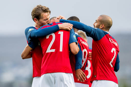 Bjørn Maars Johnsen of Norway celebrates with teammates