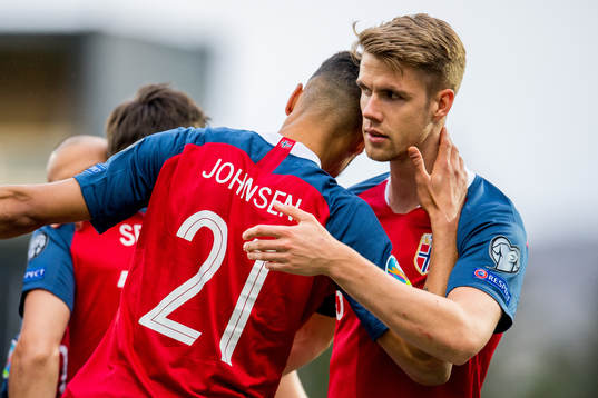 Bjørn Maars Johnsen of Norway celebrates with teammate