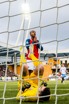 Goalkeeper Teitur Gestsson of Faroe Islands and Ola Kamara