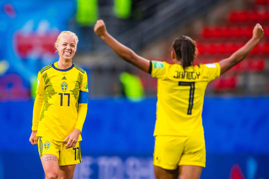 Caroline Seger and Madelen Janogy of Sweden celebrate