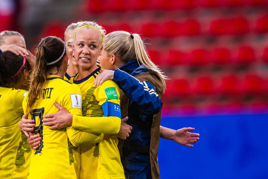 Kosovare Asllani and Caroline Seger of Sweden celebrate