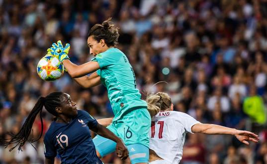 Griedge Mbock Bathy and goalkeeper Sarah Bouhaddi of France