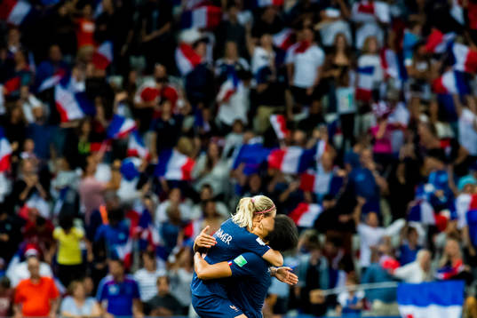 Eugénie Le Sommer and Wendie Renard celebrate