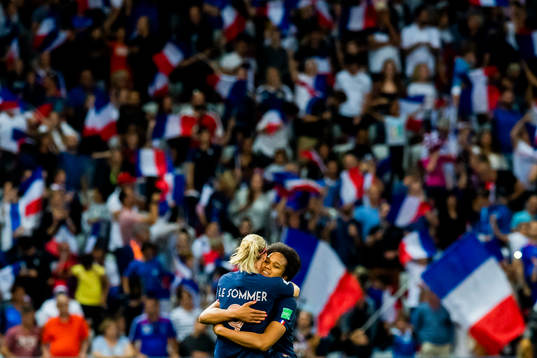 Eugénie Le Sommer and Wendie Renard celebrate