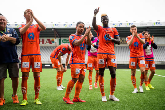 Pape Habib Gueye of Aalesund celebrates with teammates