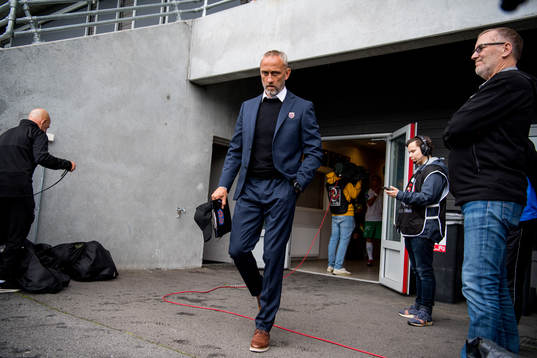 Lars Bohinen, head coach of Aalesund, enters the pitch
