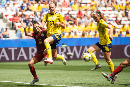 Sunisa Srangthaisong of Thailand compete for the ball with